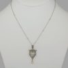 elegant Edwardian necklace is hand crafted in platinum