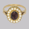 ring Set to the centre with a splendid dark red cabochon garnet