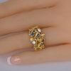 Kutchinsky diamond sapphire ring on finger