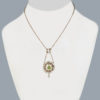 Vintage Peridot and Pearl double drop Pendant on Display
