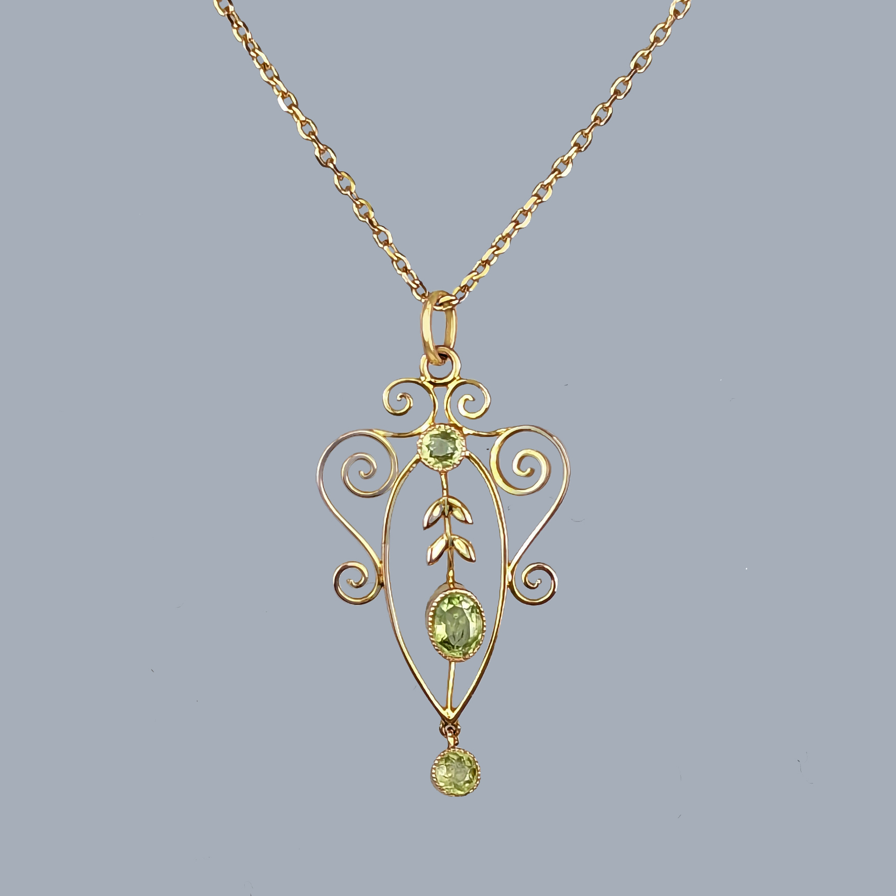 Gold Pendant set with 3 Peridot Stones on gold chain